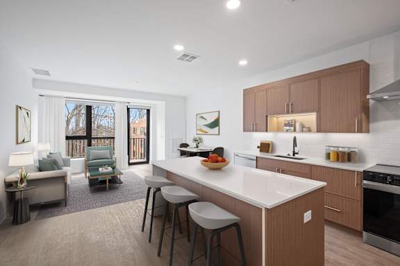 A modern kitchen with a white countertop and wooden cabinets.