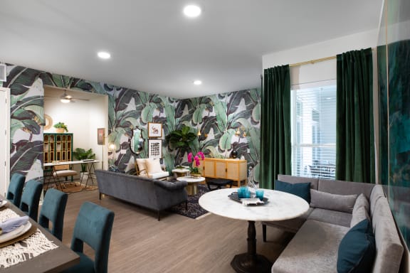 a living room filled with furniture and a large window