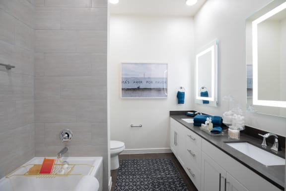 a bathroom with a tub and a sink