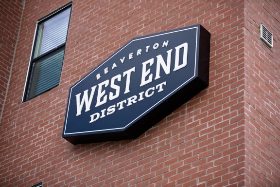 a sign on a building that says west end district