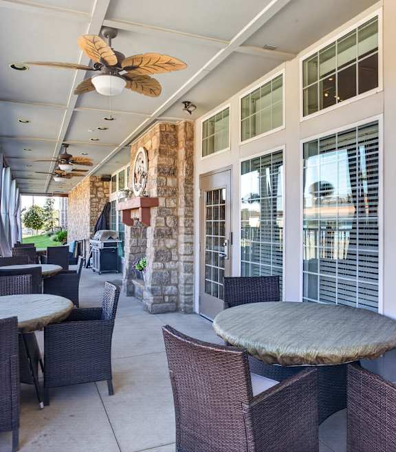 A patio with a table and chairs is shown.