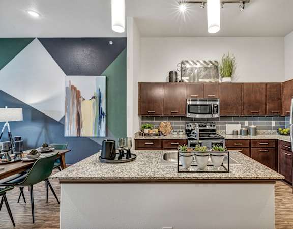 the heights on capitol hill apartments kitchen with granite countertops and stainless steel appliances at Urban Crest Apartments, San Antonio, TX, 78209
