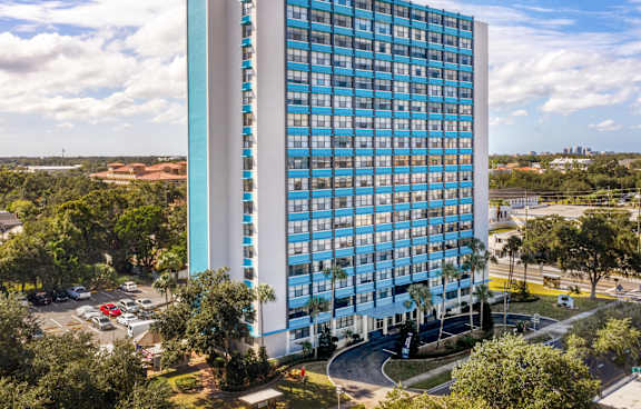 The front of a building with the name "The Indigo" on it.