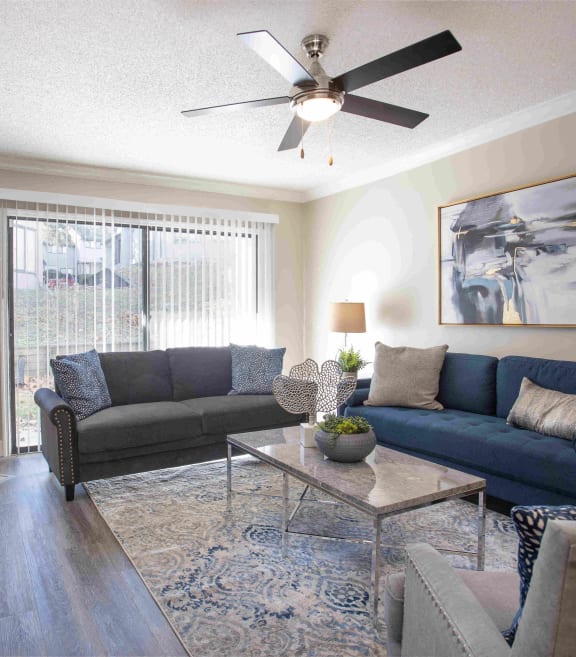 a living room with couches and a coffee table