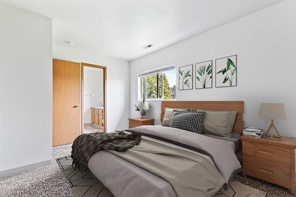 a bedroom with a bed and two night stands