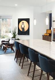 A modern kitchen with a large island in the center.