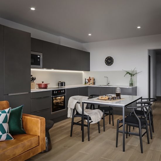 a kitchen and dining area in a 555 waverly unit