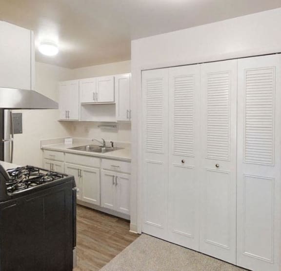 a bedroom with a bed and a ceiling fan at Wood Creek Apartments, Wisconsin