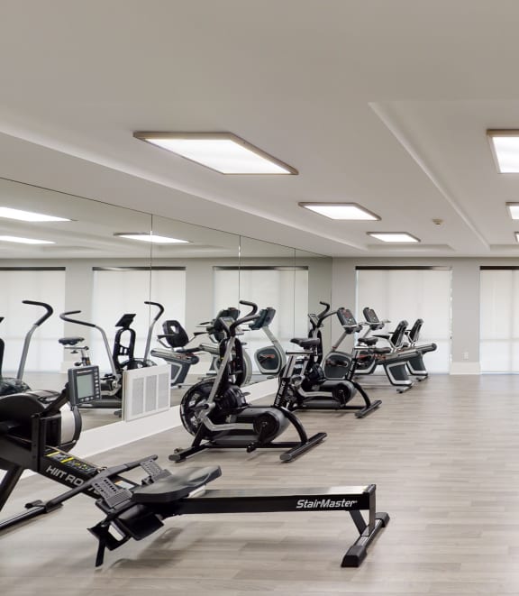a room filled with lots of cardio exercise equipment