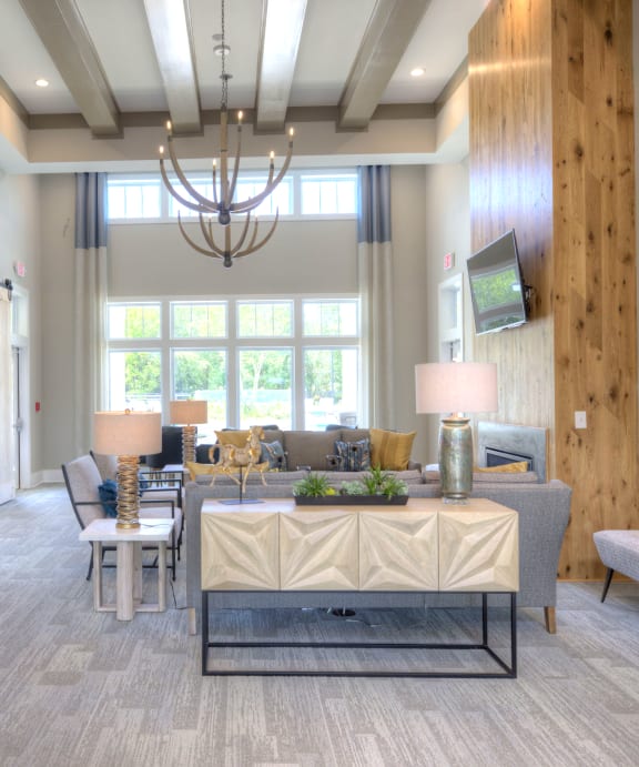 a living room and dining room with a table and chairs  at Lullwater at Big Ridge, Hixson, TN, 37343