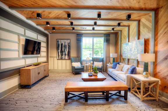 a living room with wood paneling and a ceiling with exposed beams  at Lullwater at Big Ridge, Hixson, TN, 37343