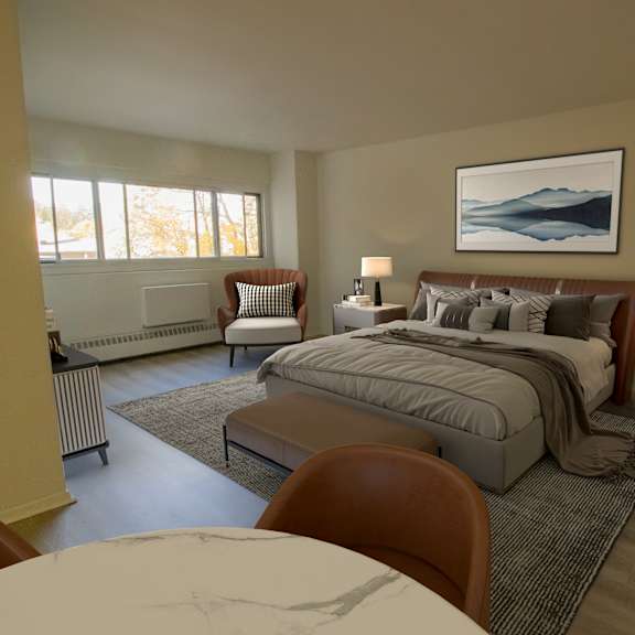 A bedroom with a large bed and a painting on the wall.