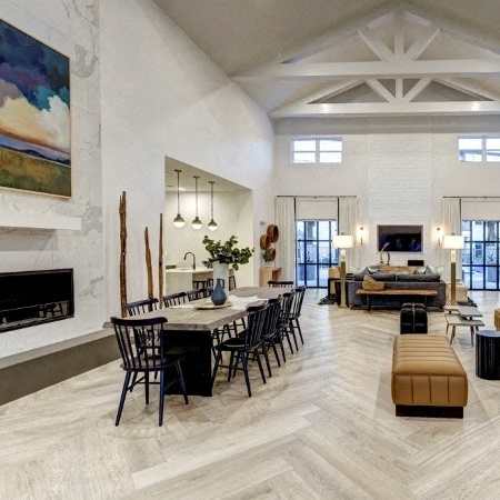 A large, open-concept living space with a fireplace and a dining area.
