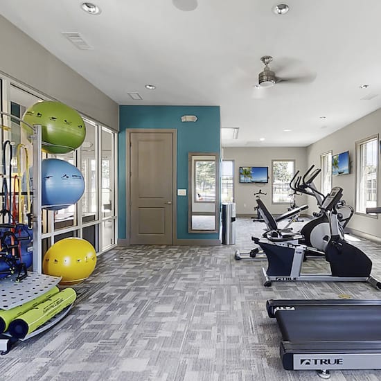 Fitness center with strength, cardio, and yoga equipment
