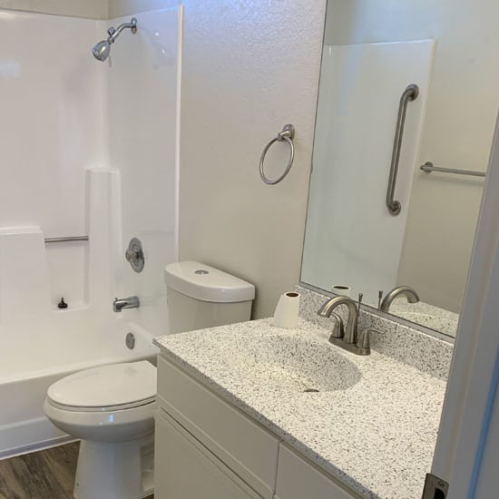 a bathroom with a toilet sink and bathtub