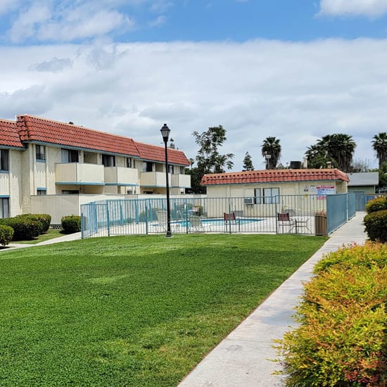 our apartments have a communal pool with lounge chairs and tables
