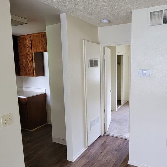 a view of the kitchen and living room in an apartment