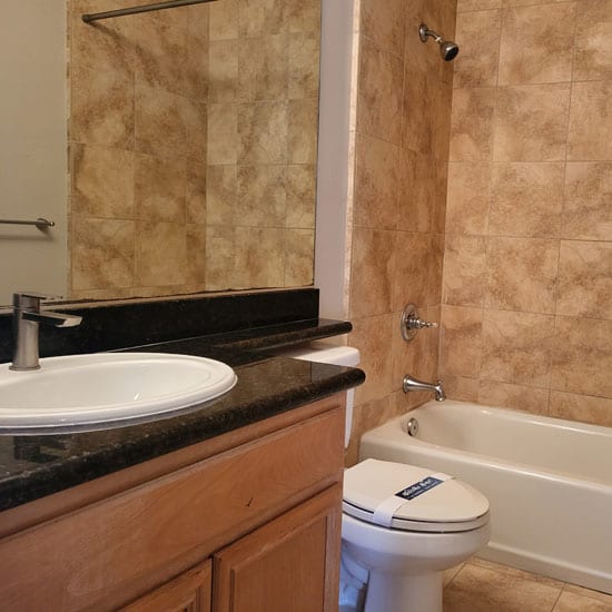 a bathroom with a sink toilet and bathtub