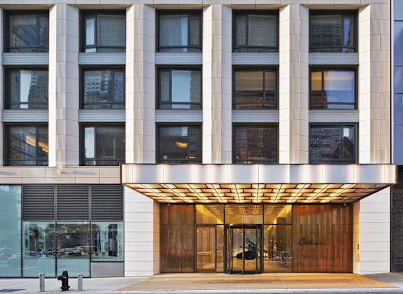 the entrance to a building with a wood revolving door