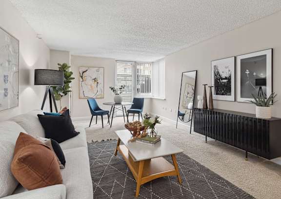 a living room with a white couch and a table