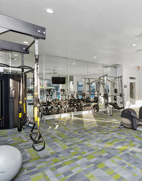 Community Fitness Center with Equipment at Park West Apartments located in Houston, TX-MEDAM.