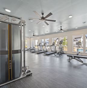 a fitness center with treadmills and other exercise equipment