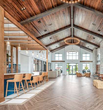 A large open space with wooden floors and a high ceiling.