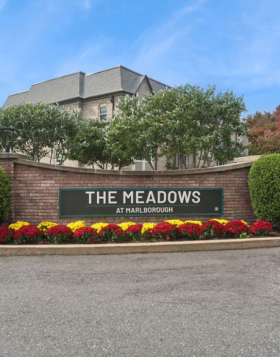 Community Monument Sign and Landscape at Meadows at Marlborough Apartments located in Marlborough, MA-MEDAM.