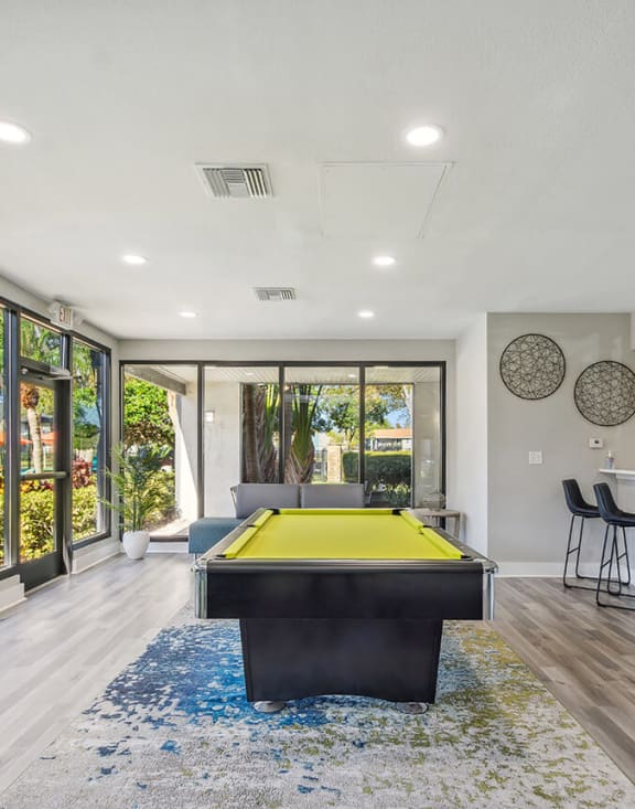Community Clubhouse with Pool Table Area at Bridges at Bayside Apartments in St. Petersburg, FL-MEDAM.
