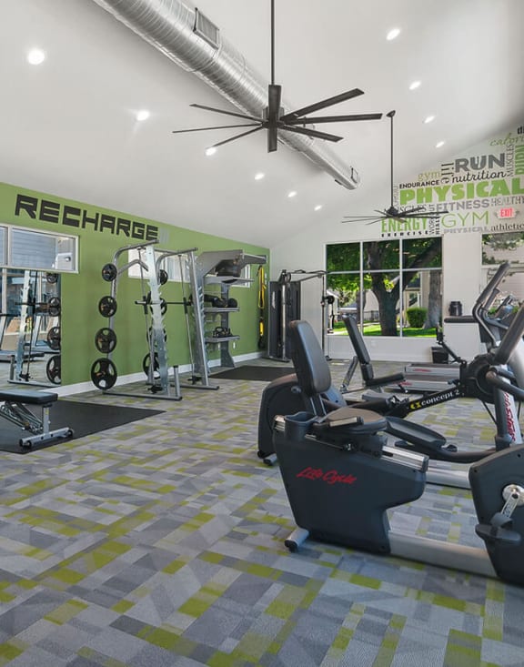 Community Fitness Center with Equipment at Broadmoor Village Apartments located in West Jordan, UT-MEDAM.