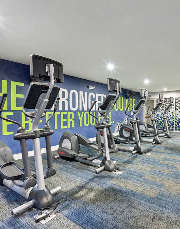 Community Fitness Center with Equipment at Dulles Green Apartments located in Herndon, VA-MEDAM.