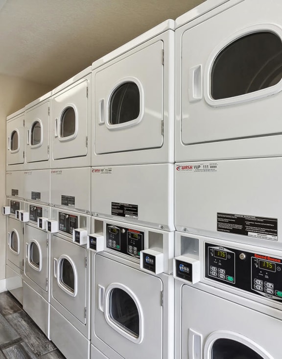 Community Laundry Center with Washing Machines and Dryers at Meadow Ridge Apartments in Las Vegas, NV-MEDAM.