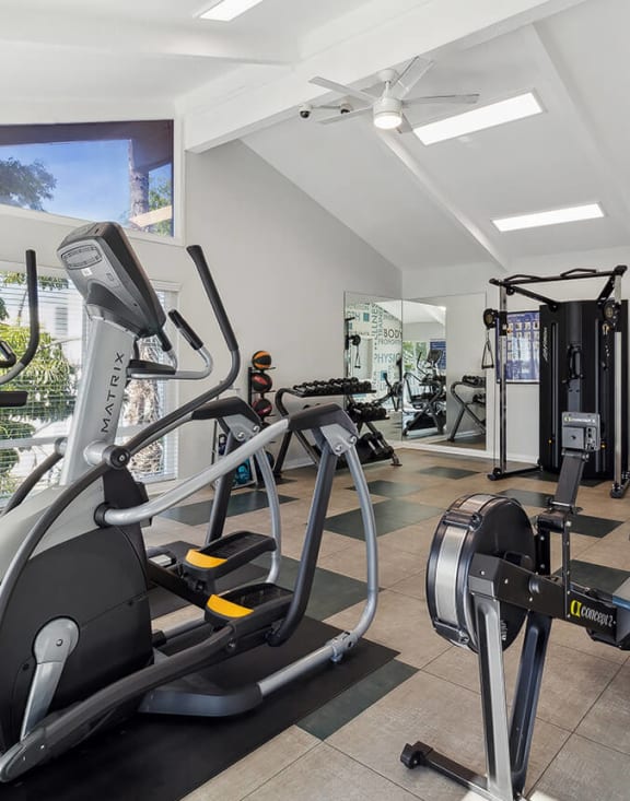Community Fitness Center with Equipment at Colonnade at Fletcher Hills Apartments in El Cajon, CA-MEDAM.