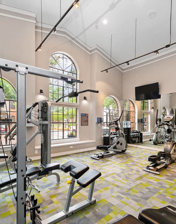 Community Fitness Center with Equipment at Dallas North Park Apartments in Dallas, TX-MEDAM.