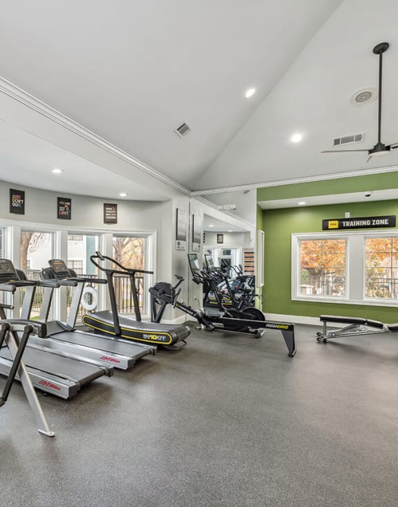 Community Fitness Center with Equipment at Bridges at Oakbend Apartments in Lewisville, TX-MEDAM.