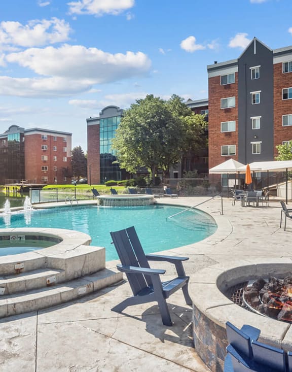 Community Swimming Pool/Hot Tub and Fire Pit Area at Esprit at Cherry Creek Apartments in Glendale, CO-MEDAM.