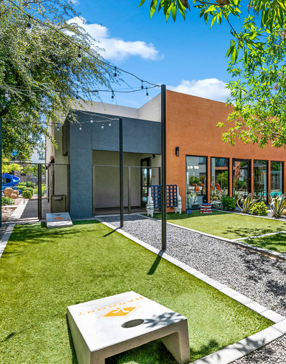 Outdoor Corn Hole Area at Harmony at Surprise Apartments located in Surprise, AZ-MEDAM.