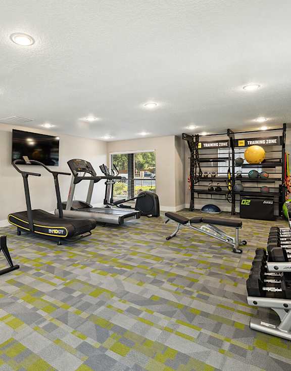 Community Fitness Center with Equipment at Arbors at Orange Park Apartments located in Orange, Park FL-MEDAM.