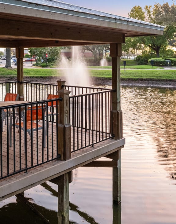 Community Pond with View of Exterior Building at Fountains at Lee Vista Apartments in Orlando, FL.