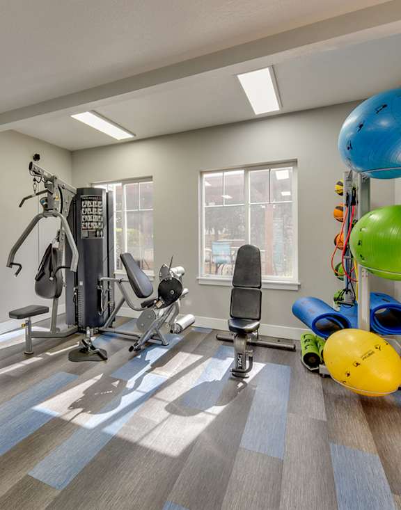 Community Fitness Center with Equipment at Landings at Morrison Apartments located in Gresham, OR-MEDAM.