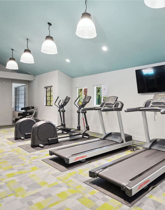 Community Fitness Center with Equipment at Creek at 2645 Apartments located in Sacramento, CA-MEDAM.