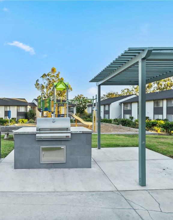 Community grill and playground in the background