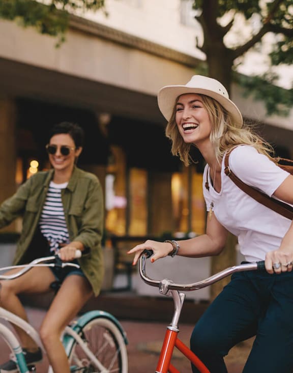 Stock Photo of Two Women Riding Bikes-MEDAM.