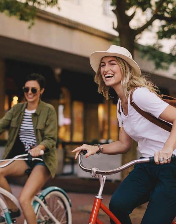 Stock Photo of Two Women Riding Bikes-MEDAM.