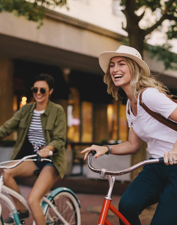 Stock Photo of Two Women Riding Bikes-MEDAM.