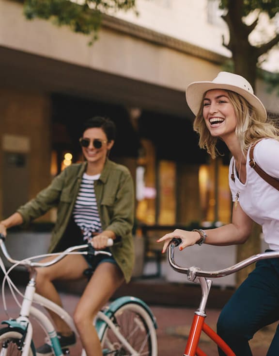 Stock Photo of Two Women Riding Bikes-MEDAM.