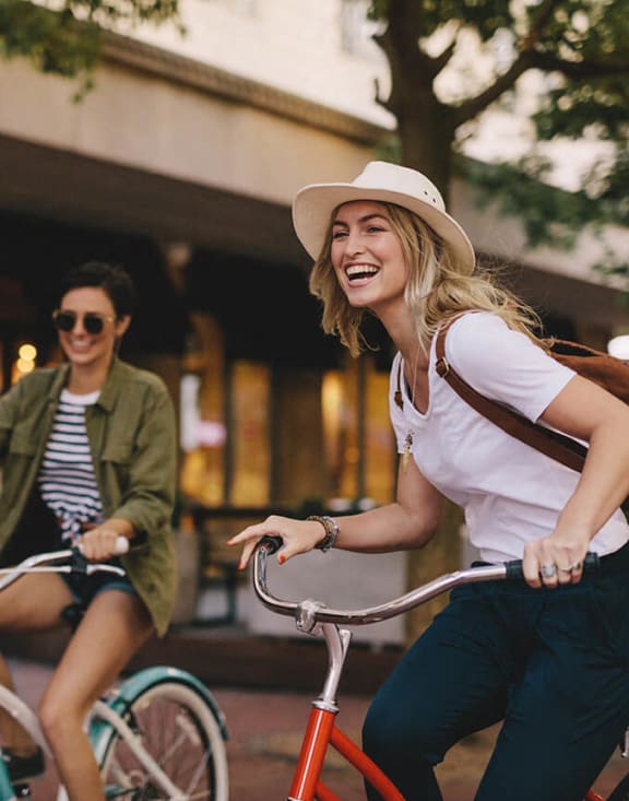 People riding bicycles down the street