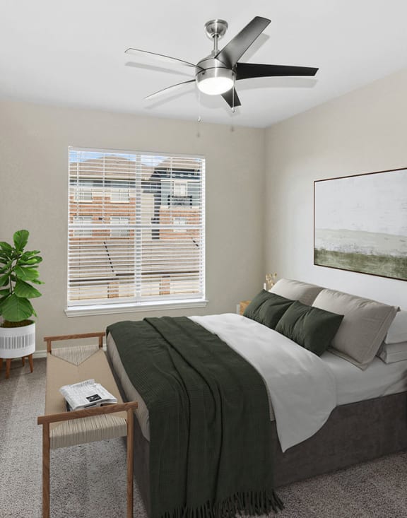 Model bedroom at The Belmont at Duck Creek Apartments in Garland, TX.