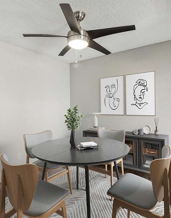 Model Dining Room with Wood-Style Flooring at Accent on Sahara Apartments located in Las Vegas, Nevada.