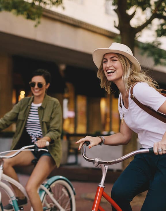 Stock Photo of Two Women Riding Bikes-MEDAM.